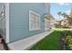 Side view of a charming light blue house at 1554 Fairview Cir, Kissimmee, FL 34747