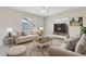 Living room with comfortable seating and large TV at 1554 Fairview Cir, Kissimmee, FL 34747