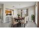 Dining room with chandelier and view to kitchen at 1554 Fairview Cir, Kissimmee, FL 34747