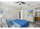 Bright bedroom with a double bed, ceiling fan, and ample closet space at 1554 Fairview Cir, Kissimmee, FL 34747