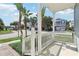 Charming front porch with white railings, offering a view of the neighborhood at 1554 Fairview Cir, Kissimmee, FL 34747