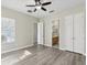 Bright bedroom with wood flooring and ceiling fan at 1554 Fairview Cir, Kissimmee, FL 34747