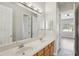 Clean bathroom featuring double sinks and access to bedroom at 1554 Fairview Cir, Kissimmee, FL 34747