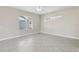 Spacious living room with tile flooring and large window at 1554 Fairview Cir, Kissimmee, FL 34747
