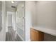 Home hallway with wood flooring and built-in cabinets at 1554 Fairview Cir, Kissimmee, FL 34747
