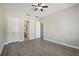 Large bedroom with ceiling fan and access to bathroom and closet at 1554 Fairview Cir, Kissimmee, FL 34747