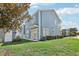 Charming light blue house with a well-maintained lawn at 1554 Fairview Cir, Kissimmee, FL 34747