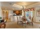 Dining area with a table and four chairs, near the kitchen at 1106 Sunset View Cir # 201, Reunion, FL 34747