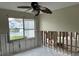 A bedroom under renovation, with damaged walls and exposed framing at 2512 Woodgate Blvd # 104, Orlando, FL 32822