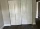 Spacious bedroom closet with built-in shelving at 2512 Woodgate Blvd # 104, Orlando, FL 32822