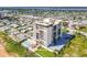 Oceanfront condo building with pool and surrounding neighborhood at 1513 Ocean Shore Blvd # 9E, Ormond Beach, FL 32176
