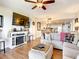 Spacious living room with fireplace and large TV at 1513 Ocean Shore Blvd # 9E, Ormond Beach, FL 32176