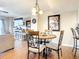 Charming dining room with round table and four chairs at 1513 Ocean Shore Blvd # 9E, Ormond Beach, FL 32176