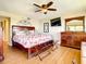 Primary bedroom with king bed and large TV at 1513 Ocean Shore Blvd # 9E, Ormond Beach, FL 32176