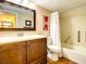 Well-appointed bathroom with tub and wood vanity at 1513 Ocean Shore Blvd # 9E, Ormond Beach, FL 32176