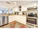 Modern kitchen with stainless steel appliances and wood countertops at 1513 Ocean Shore Blvd # 9E, Ormond Beach, FL 32176