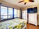 Bedroom with ocean view and dresser at 1513 Ocean Shore Blvd # 9E, Ormond Beach, FL 32176