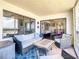 Relaxing balcony with seating area and sliding glass doors leading to bedroom at 1513 Ocean Shore Blvd # 9E, Ormond Beach, FL 32176