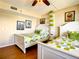 Guest bedroom with twin beds and cheerful decor at 1513 Ocean Shore Blvd # 9E, Ormond Beach, FL 32176