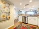 Kitchen with stainless steel dishwasher and view to living room at 1513 Ocean Shore Blvd # 9E, Ormond Beach, FL 32176