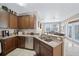 Well-equipped kitchen with ample cabinetry and granite countertops at 165 Captain Hook Way, Davenport, FL 33837