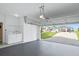 Garage with laundry and view of backyard at 165 Captain Hook Way, Davenport, FL 33837
