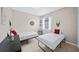 Guest bedroom with two twin beds and a window with blinds at 165 Captain Hook Way, Davenport, FL 33837