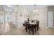 Spacious dining area with seating for four and entryway view at 165 Captain Hook Way, Davenport, FL 33837