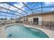 Inviting pool area with screened enclosure at 165 Captain Hook Way, Davenport, FL 33837