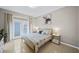 Main bedroom with king bed and access to private patio at 165 Captain Hook Way, Davenport, FL 33837