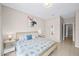 Main bedroom with king-size bed and access to another room at 165 Captain Hook Way, Davenport, FL 33837