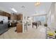 Open concept kitchen and game room with foosball table at 165 Captain Hook Way, Davenport, FL 33837