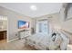 Main bedroom with king bed, private bathroom access, and pool view at 165 Captain Hook Way, Davenport, FL 33837