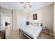Bright bedroom with a queen bed, double closet and view of another room at 165 Captain Hook Way, Davenport, FL 33837