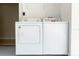 Convenient laundry room with washer and dryer at 165 Captain Hook Way, Davenport, FL 33837