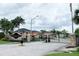 Gated community entrance with signage at 165 Captain Hook Way, Davenport, FL 33837