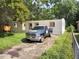 Unfinished home exterior with a driveway at 4022 Shellman St, Orlando, FL 32811