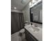 Clean bathroom with tub shower combo and updated vanity at 242 Aidan'S Lndg, Haines City, FL 33844