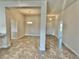 Open concept dining room with tile floors and light fixtures at 1278 Tagliamento Ln, Haines City, FL 33844
