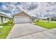 One-story house with a garage and landscaping at 1278 Tagliamento Ln, Haines City, FL 33844
