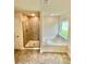 Bathroom featuring a walk-in shower and garden tub at 1278 Tagliamento Ln, Haines City, FL 33844