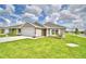 One-story house with a two-car garage and landscaped yard at 1278 Tagliamento Ln, Haines City, FL 33844