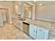 Modern kitchen with white cabinets and granite countertops at 1278 Tagliamento Ln, Haines City, FL 33844