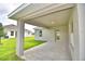 Covered patio with concrete flooring and access to backyard at 1278 Tagliamento Ln, Haines City, FL 33844