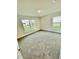 Bright bedroom with neutral carpeting and two windows at 1278 Tagliamento Ln, Haines City, FL 33844