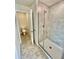 Bathroom with shower and access to another bathroom at 1278 Tagliamento Ln, Haines City, FL 33844