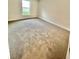 Spacious bedroom with neutral carpeting and large window at 1278 Tagliamento Ln, Haines City, FL 33844