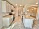 Open concept kitchen with stainless steel appliances and island at 1278 Tagliamento Ln, Haines City, FL 33844