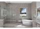 Luxury bathroom with marble finishes and lake view at 260 Deer Isle Dr, Winter Garden, FL 34787