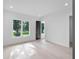 Bright bedroom featuring hardwood floors and large windows with water views at 260 Deer Isle Dr, Winter Garden, FL 34787